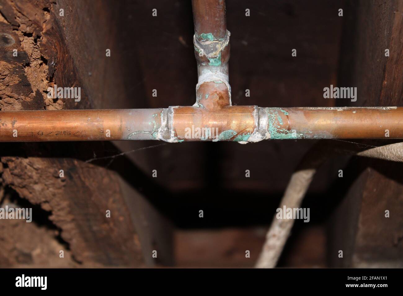 Corrosion on a Copper Pipe from Acidic Well Water Stock Photo