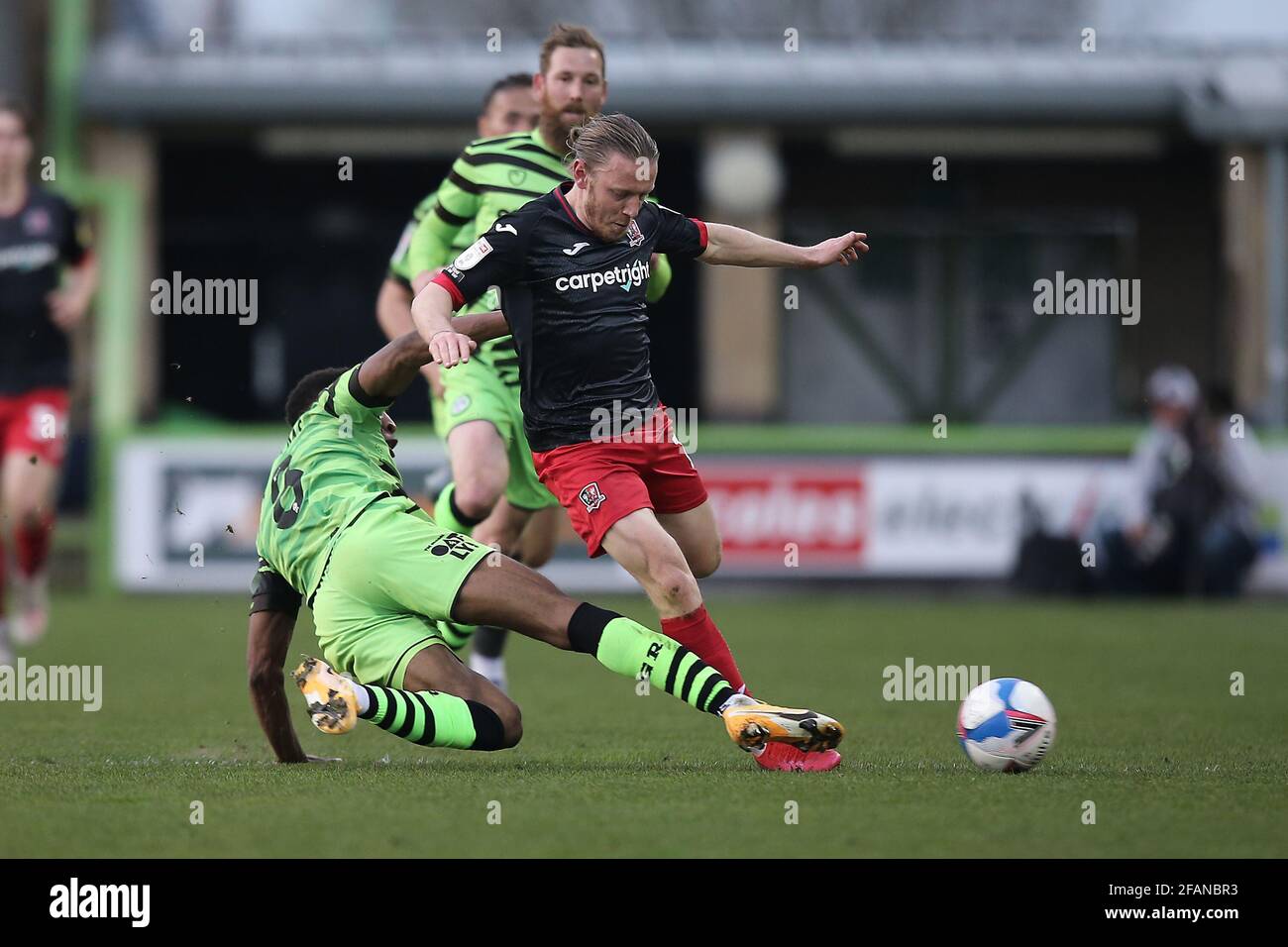 Ebou Adams of Forest Green Rovers tackles Matt Jay of Exeter City during the Sky Bet League 2 match between Forest Green Rovers and Exeter City at The Stock Photo