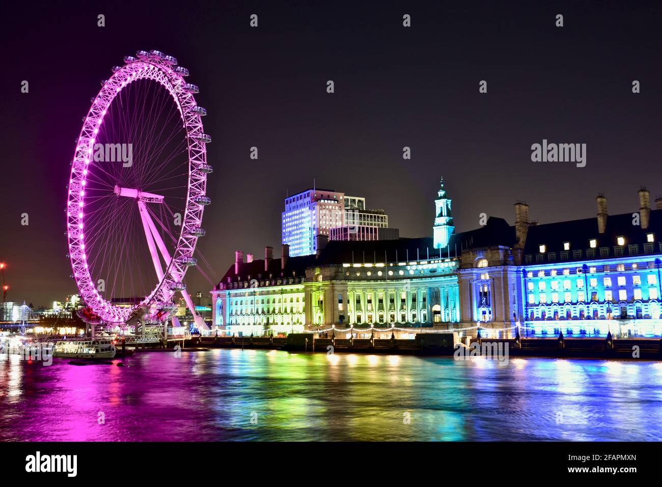 London Eye by night, colorful thames river view Stock Photo