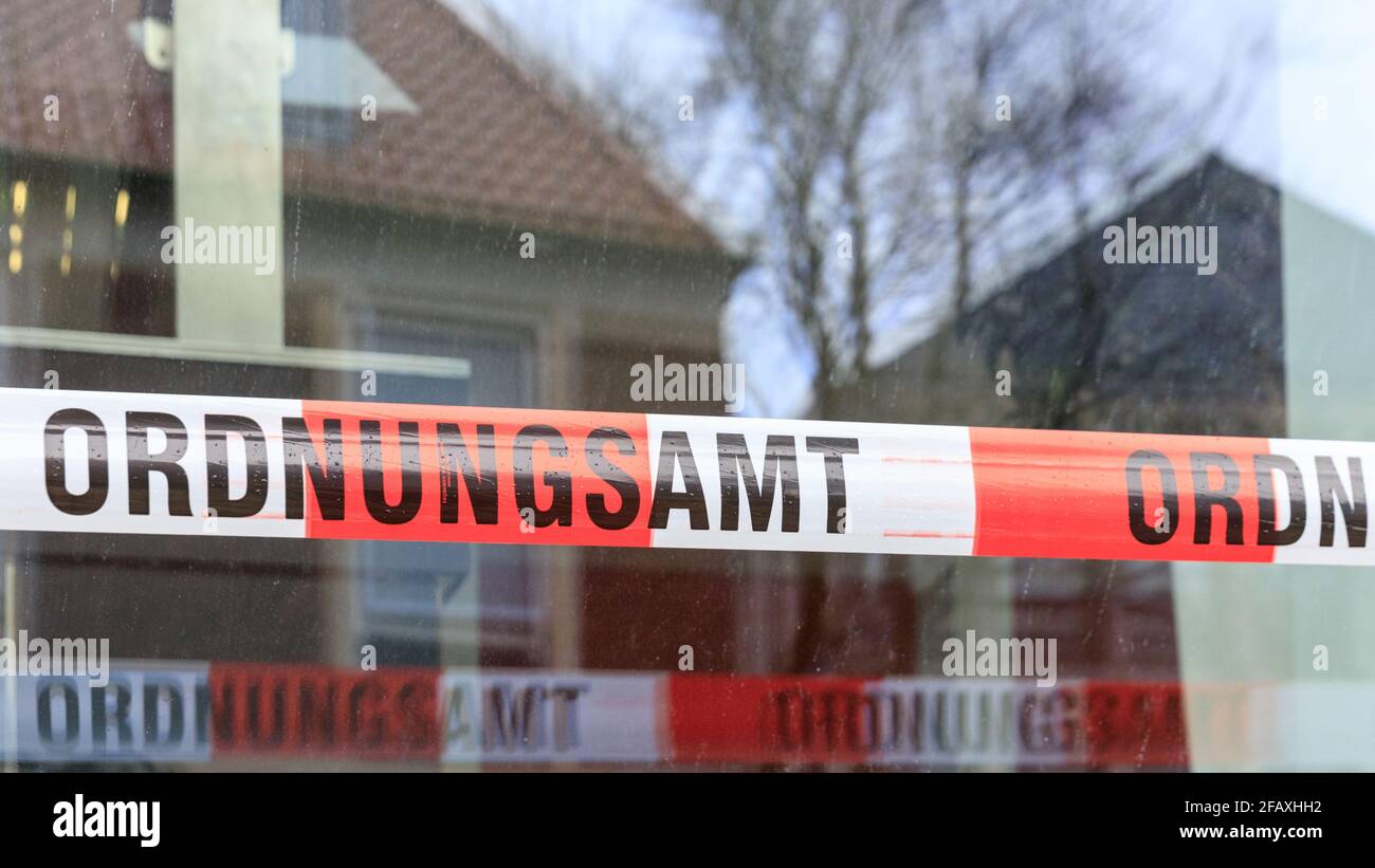 Ordnungsamt (office for public order) barrier tape used to cordon off a public space for no entry in Muenster, Germany Stock Photo