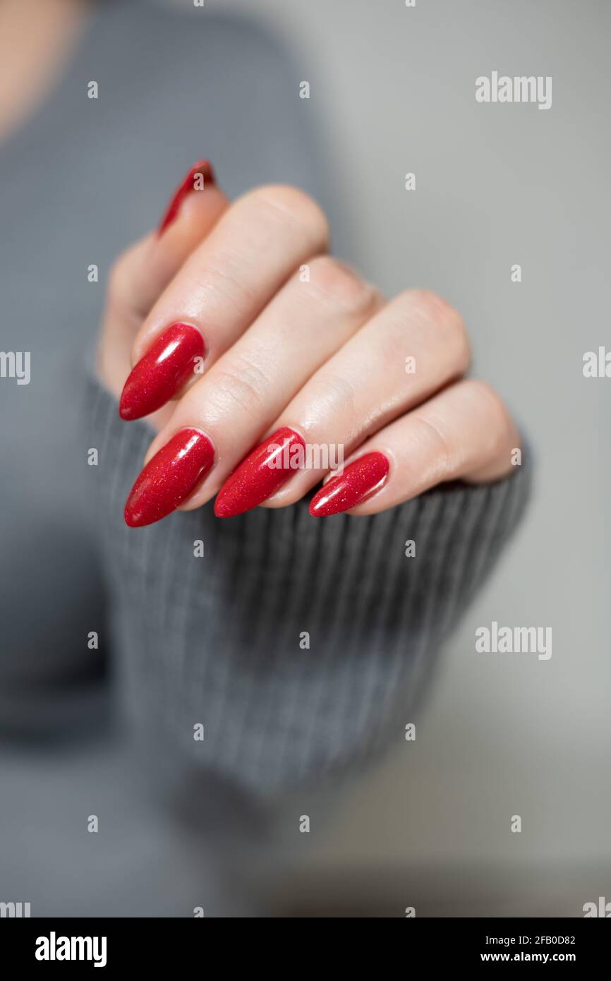 Woman S Hands With Long Nails And A Bottle Of Bright Red Nail Polish Stock Photo Alamy Woman S Hands With Long Nails And A Bottle Of Bright Red Nail Polish Stock Photo Alamy