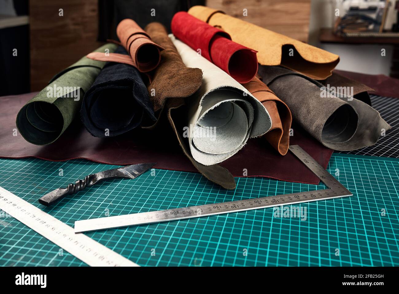 Artificial leather samples on a cow leather background. Top view Stock Photo