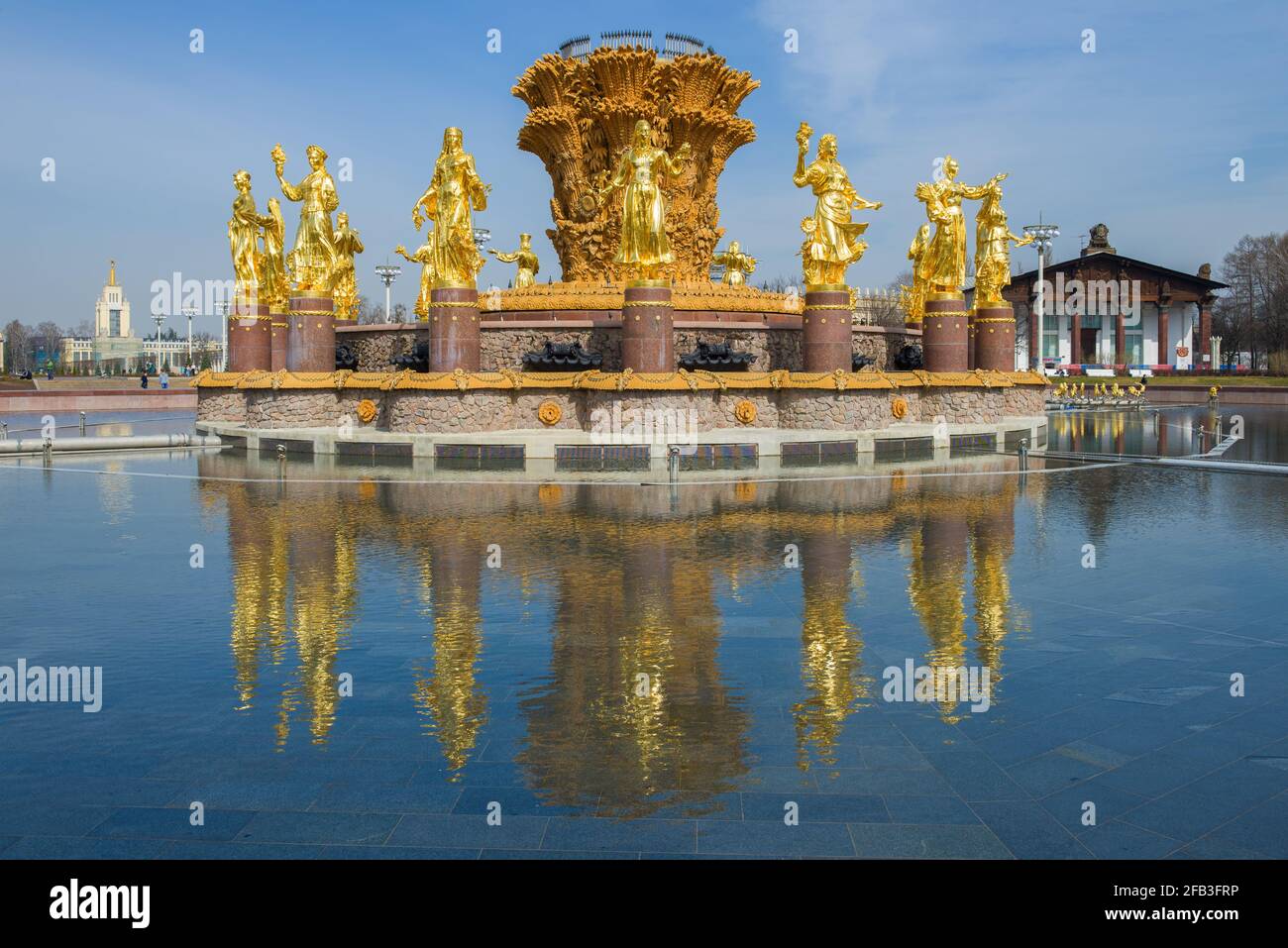 MOSCOW, RUSSIA - APRIL 14, 2021: The non-working fountain of 'Friendship of Peoples' with a reflection of the sunny April day. All-Russia Exhibition Stock Photo