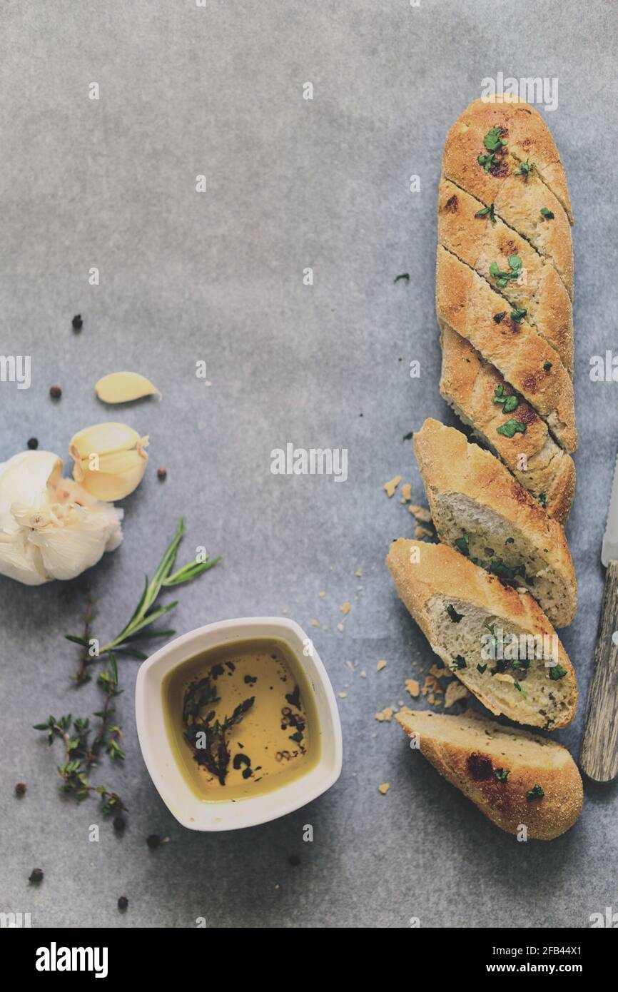 Flat lay of fresh baked homemade bread baguette ciabatta garlic and ...