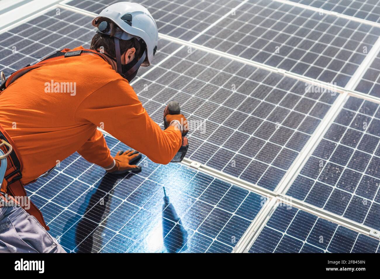 Unrecognizable solar panel technician working in Spanish installation Stock Photo