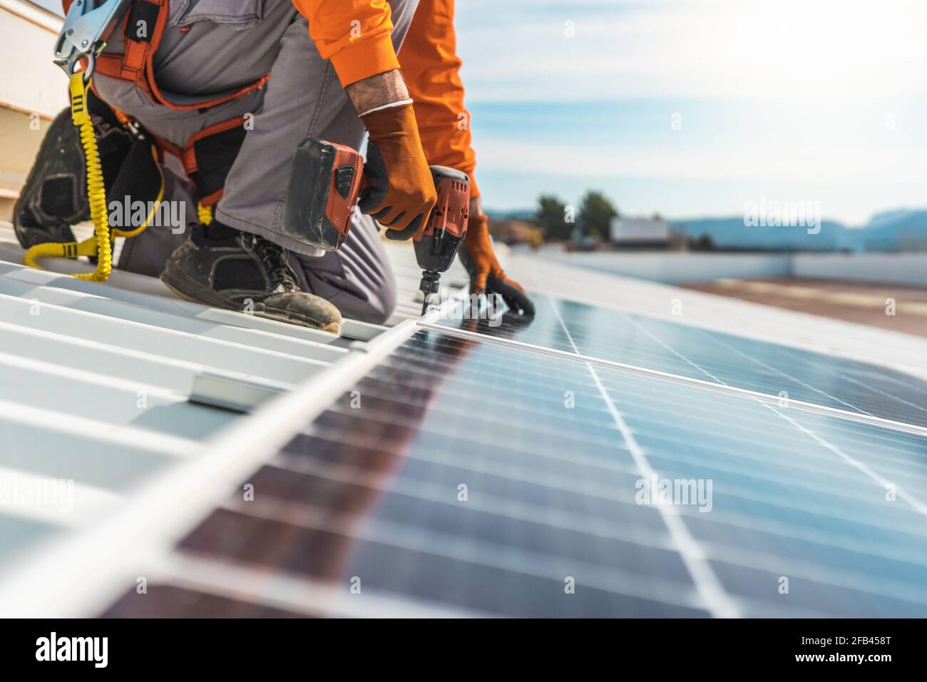Unrecognizable solar panel technician working in Spanish installation Stock Photo