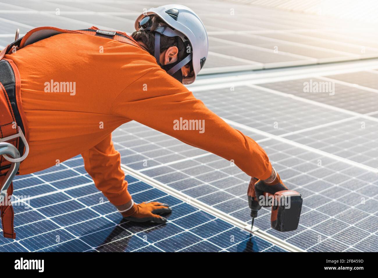 Unrecognizable solar panel technician working in Spanish installation Stock Photo