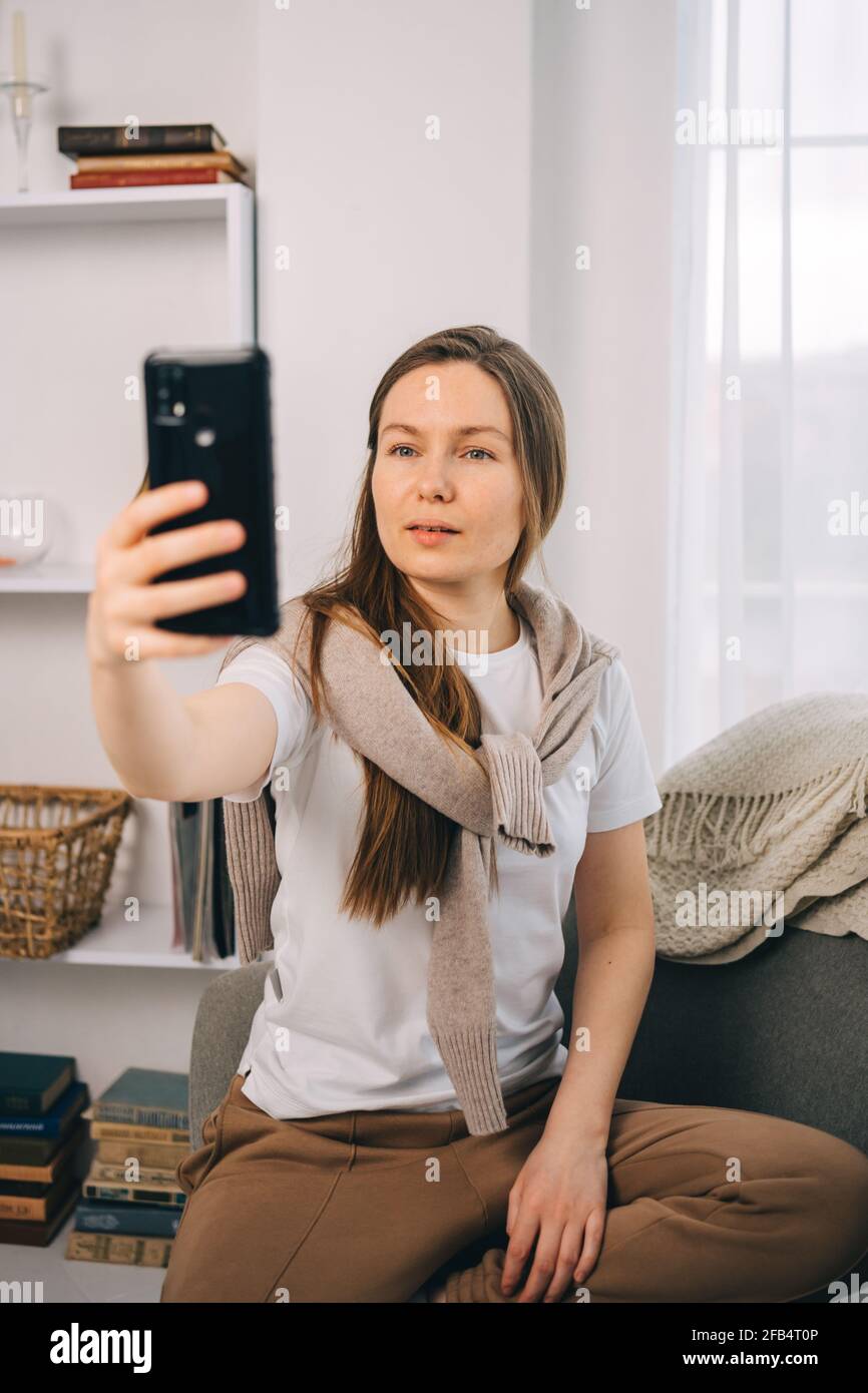 Pretty girl taking a selfie on the phone Stock Photo - Alamy