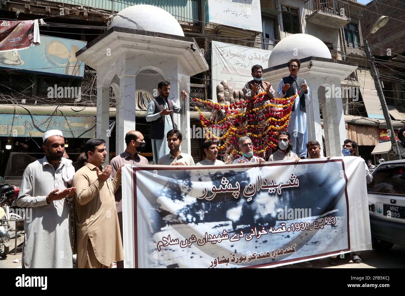 Members of Gandhara Hindko Board participate in rally to pay tribute to the score of people, who were killed 78 years ago by the firing of British Troops in Qissa Khawani Bazar Tragedy on 23rd April 1930, at Qissa Khawani Bazar in Peshawar on Friday, April 23, 2021. Stock Photo