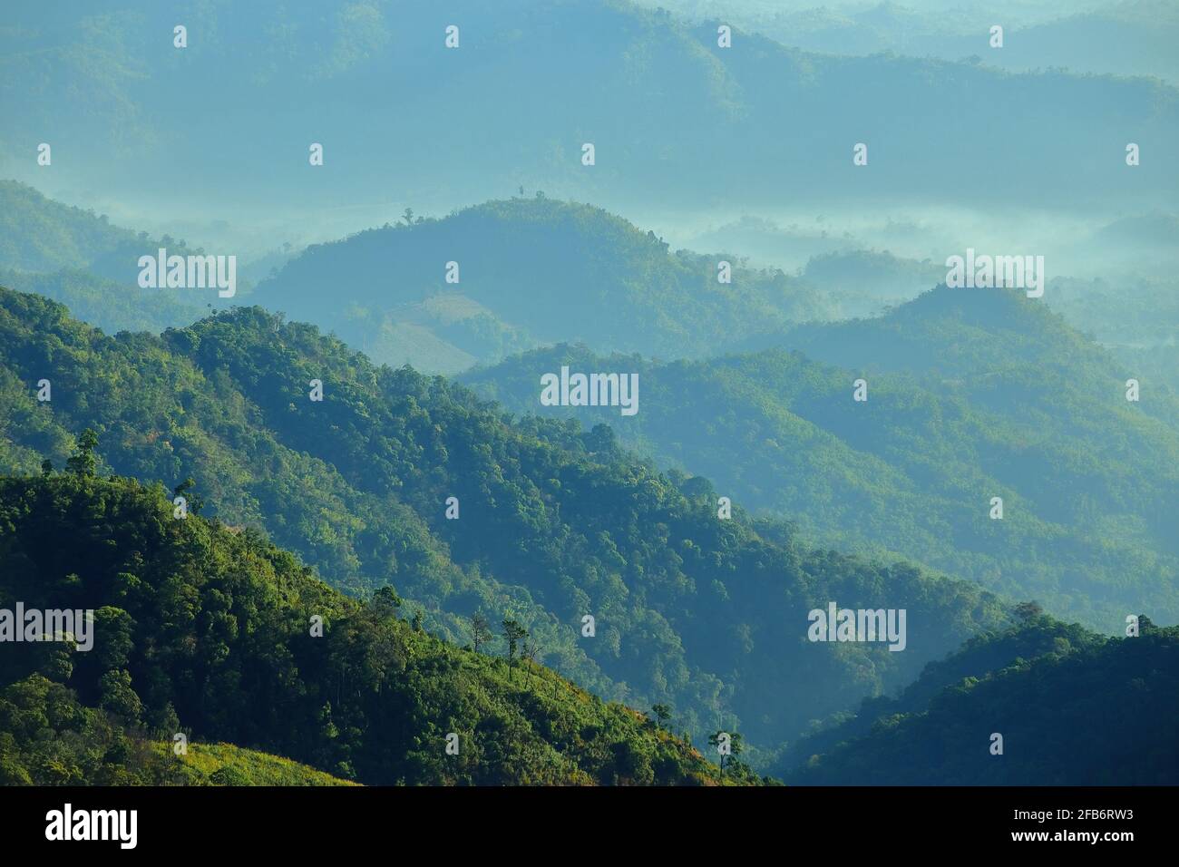 The green mountains in the morning are sunny Stock Photo - Alamy