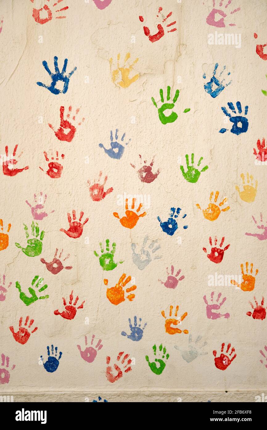 Painted wall with child's hands. Ericeira, Portugal Stock Photo