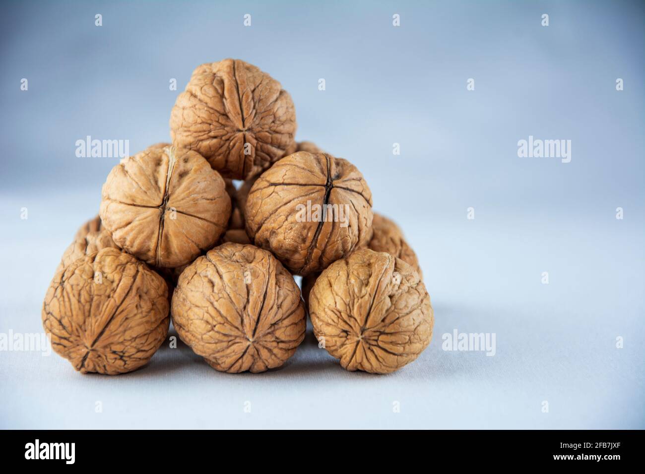 Pile of walnuts on white isolated background Stock Photo