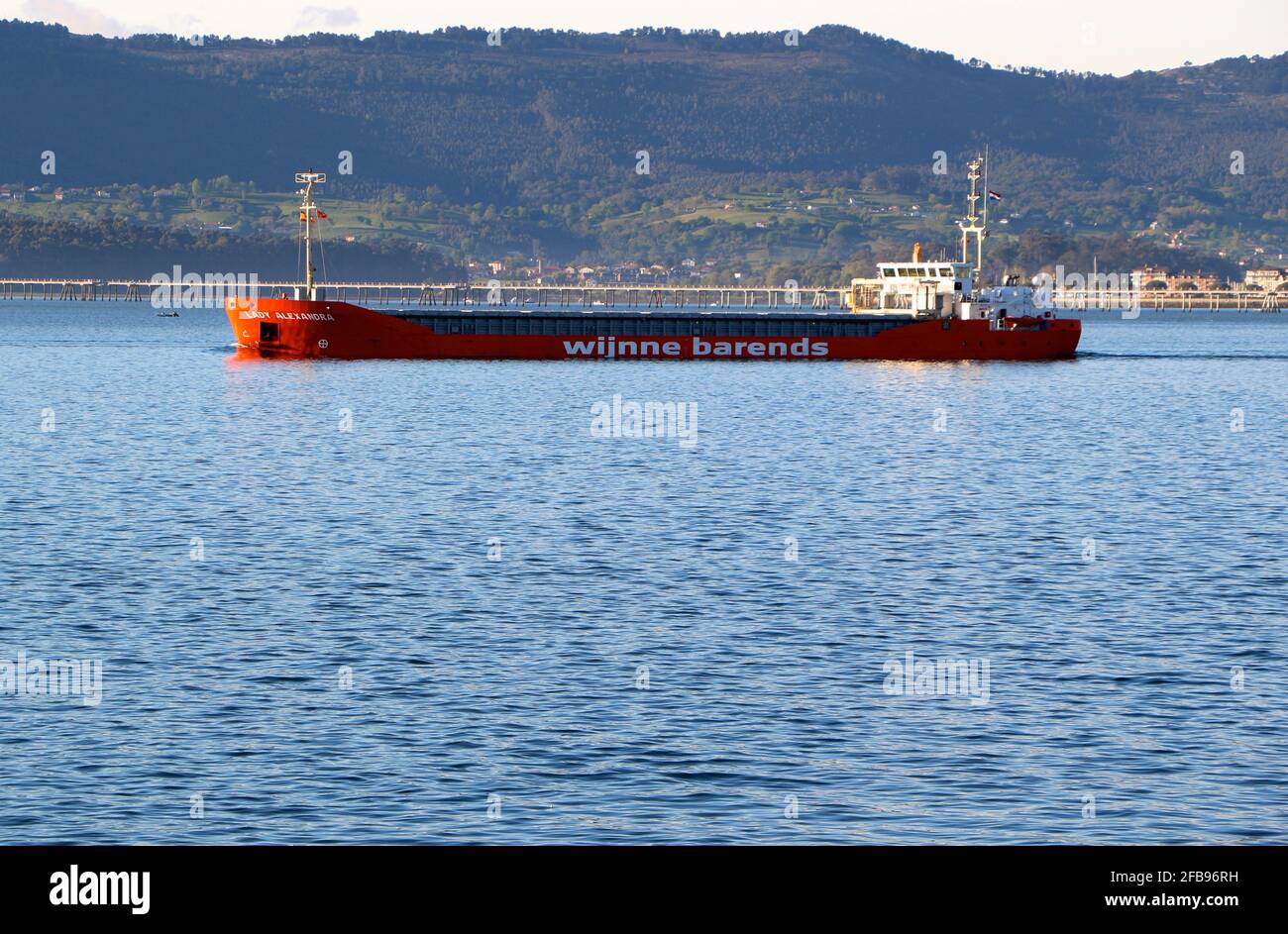 The Lady Alexandra Dutch cargo ship leaving the port of Santander Cantabria Spain in the bay on a calm sunny spring morning Stock Photo