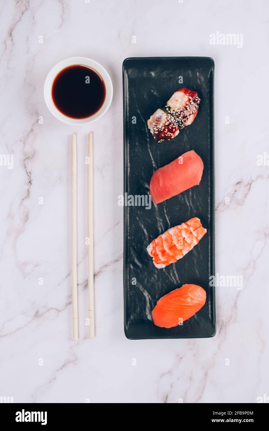 Set of traditional japanese nigiri sushi, soy sauce and chopsticks on ...