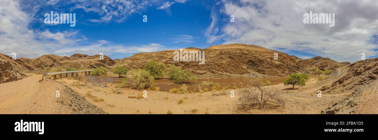 Panorama of Kuiseb river in Namibia with much water after heavy rainfalls, Namib-Naukluft National Park, background blue sky Stock Photo