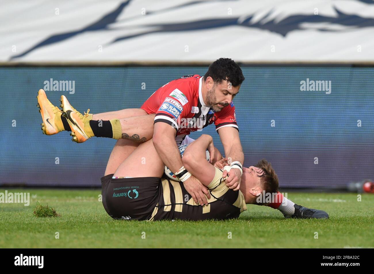 Rhys Williams (22) of Salford Red Devils tackles Keanan Brand (24) of Leigh Centurions Stock Photo