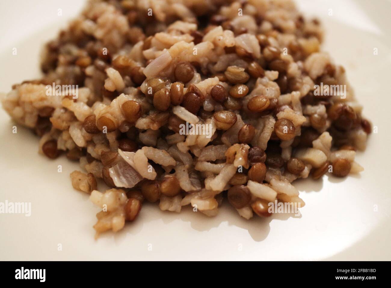 Rice and brown lentils in Egyptian dish called koshari Stock Photo