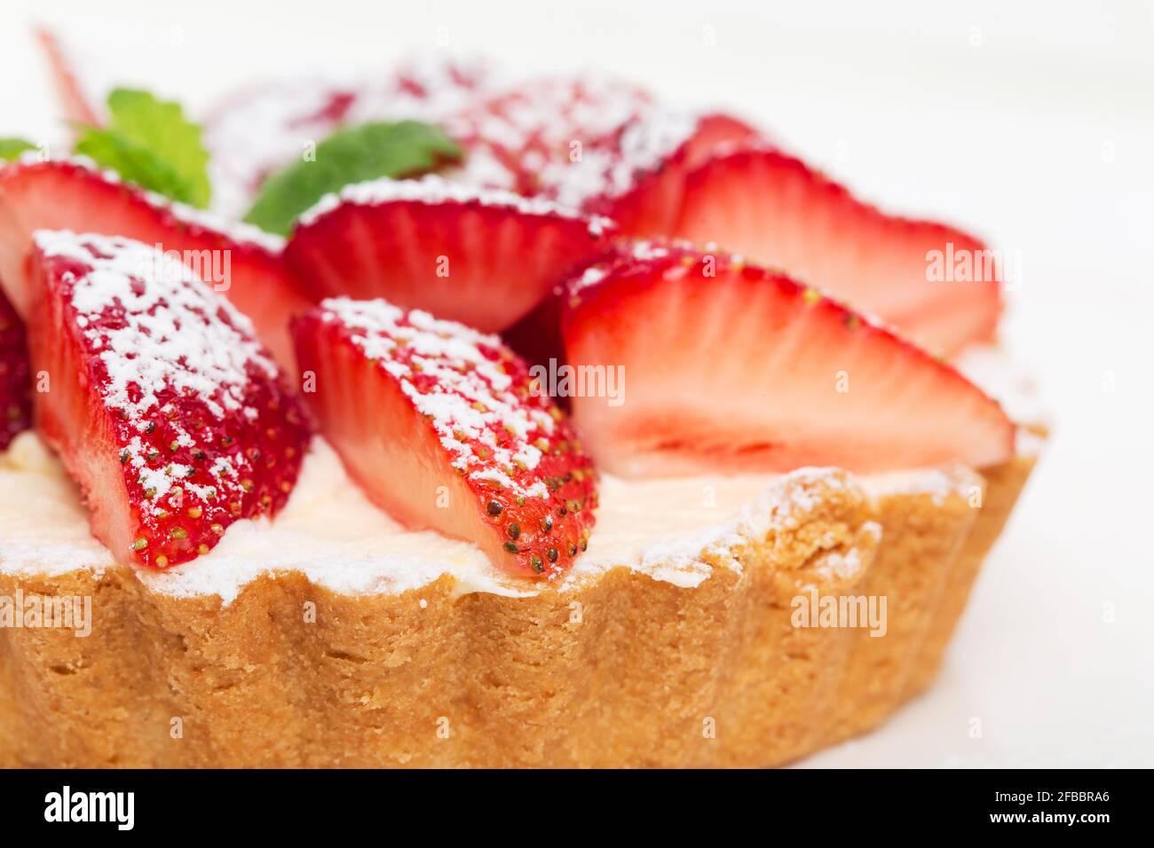 Delicious strawberry shortcake with whipped cream and fresh mint. Macro ...