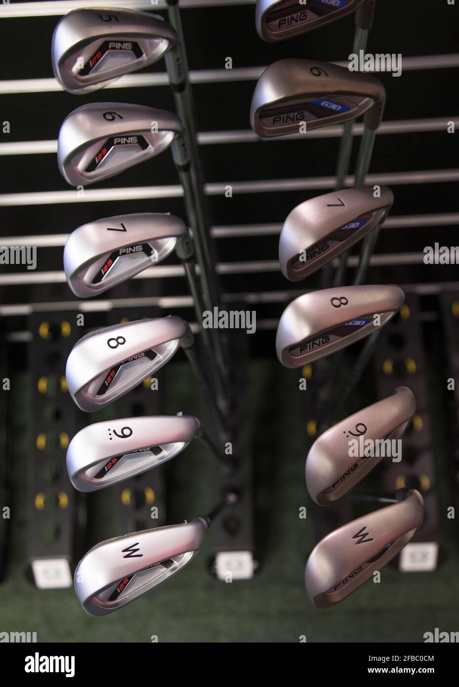 Golf clubs for sale in a golf shop Stock Photo Alamy