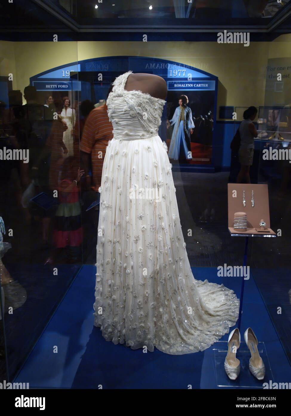 The white silk chiffon gown, shoes, and jewelry Michelle Obama wore for the 2009 inaugural balls are displayed in the Smithsonian. Stock Photo