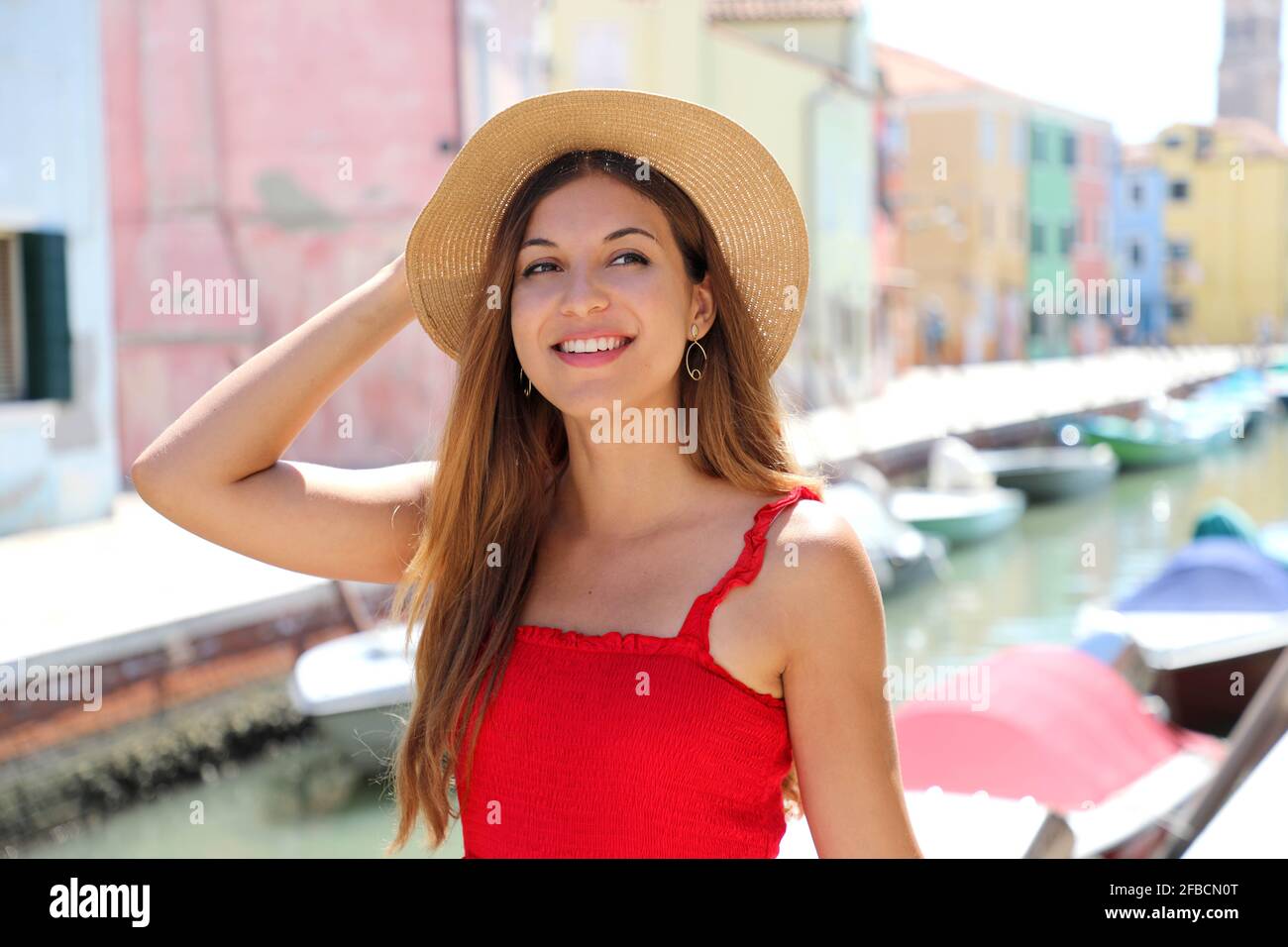 Close up of happy young elegant girl with hat looking to the side Stock Photo
