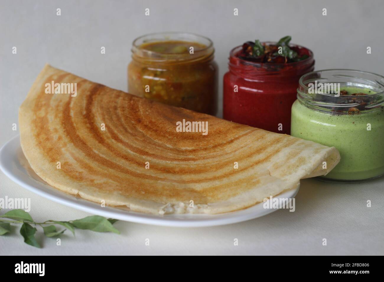 Crispy pancake made of rice and lentils. Served with spicy beetroot
