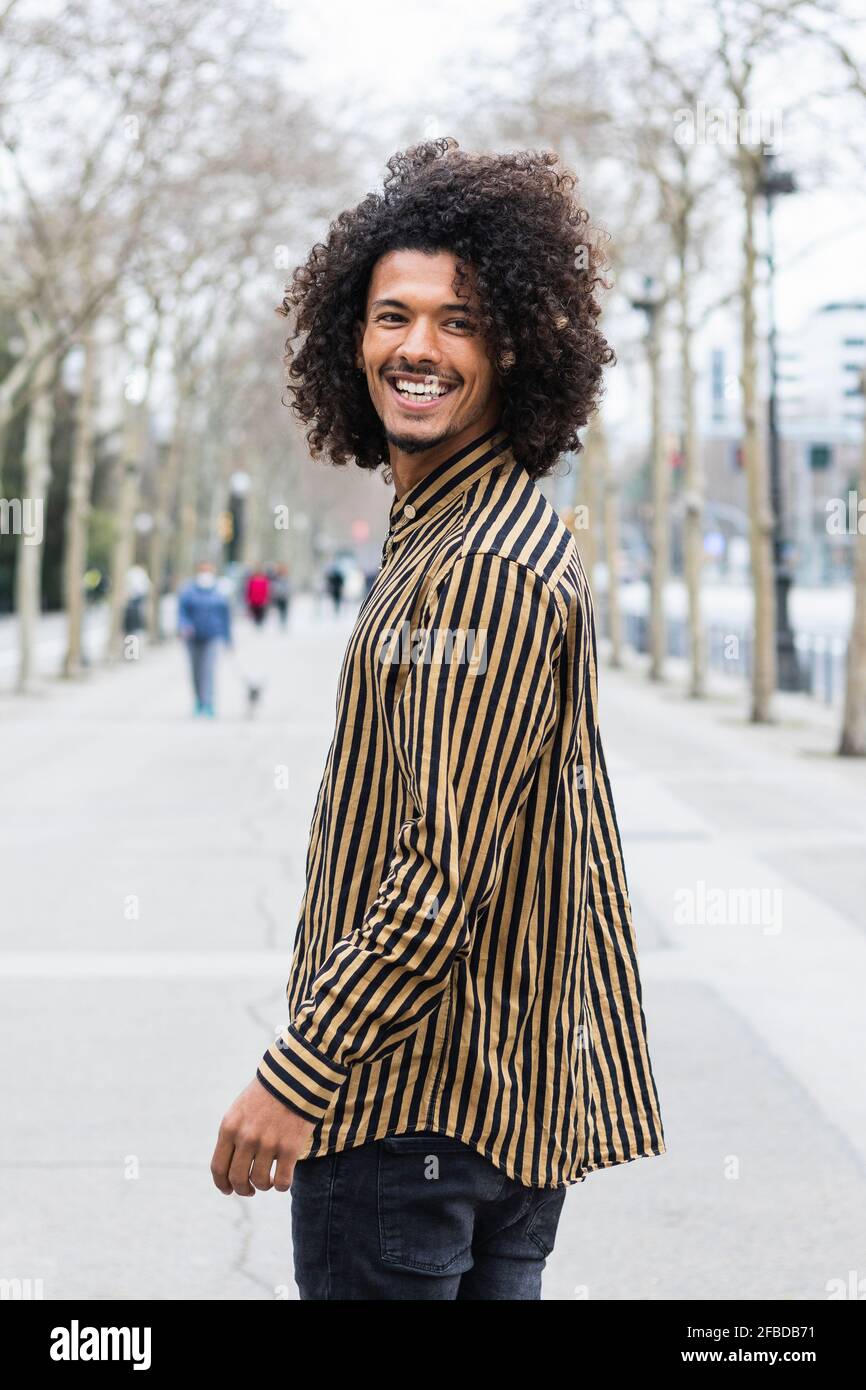 Cheerful curly business man hi-res stock photography and images - Alamy