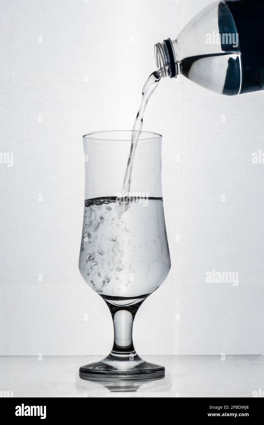 Putting Water on Glass, white background, Glass photo Stock Photo Alamy
