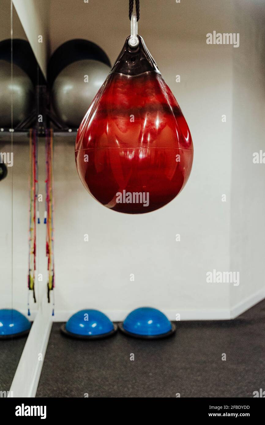Red punching bag at health club Stock Photo Alamy