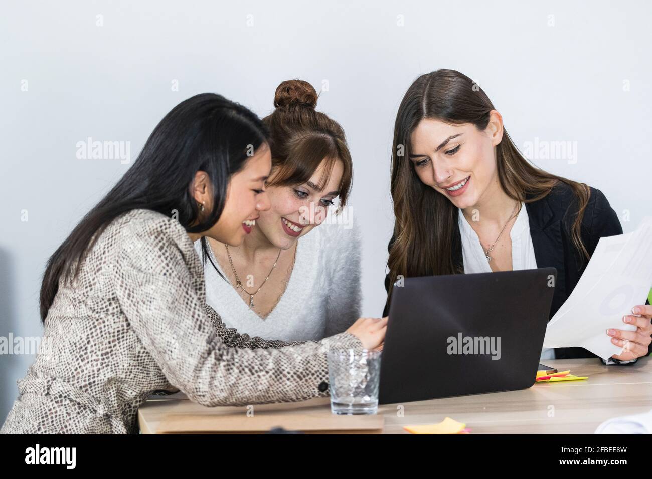 Smiling creative business team working hi-res stock photography and ...