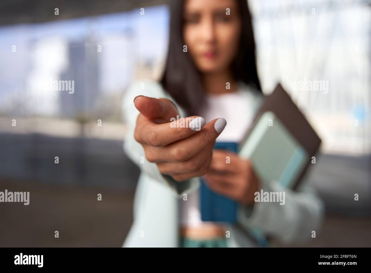 Female professional with hand outstretched Stock Photo
