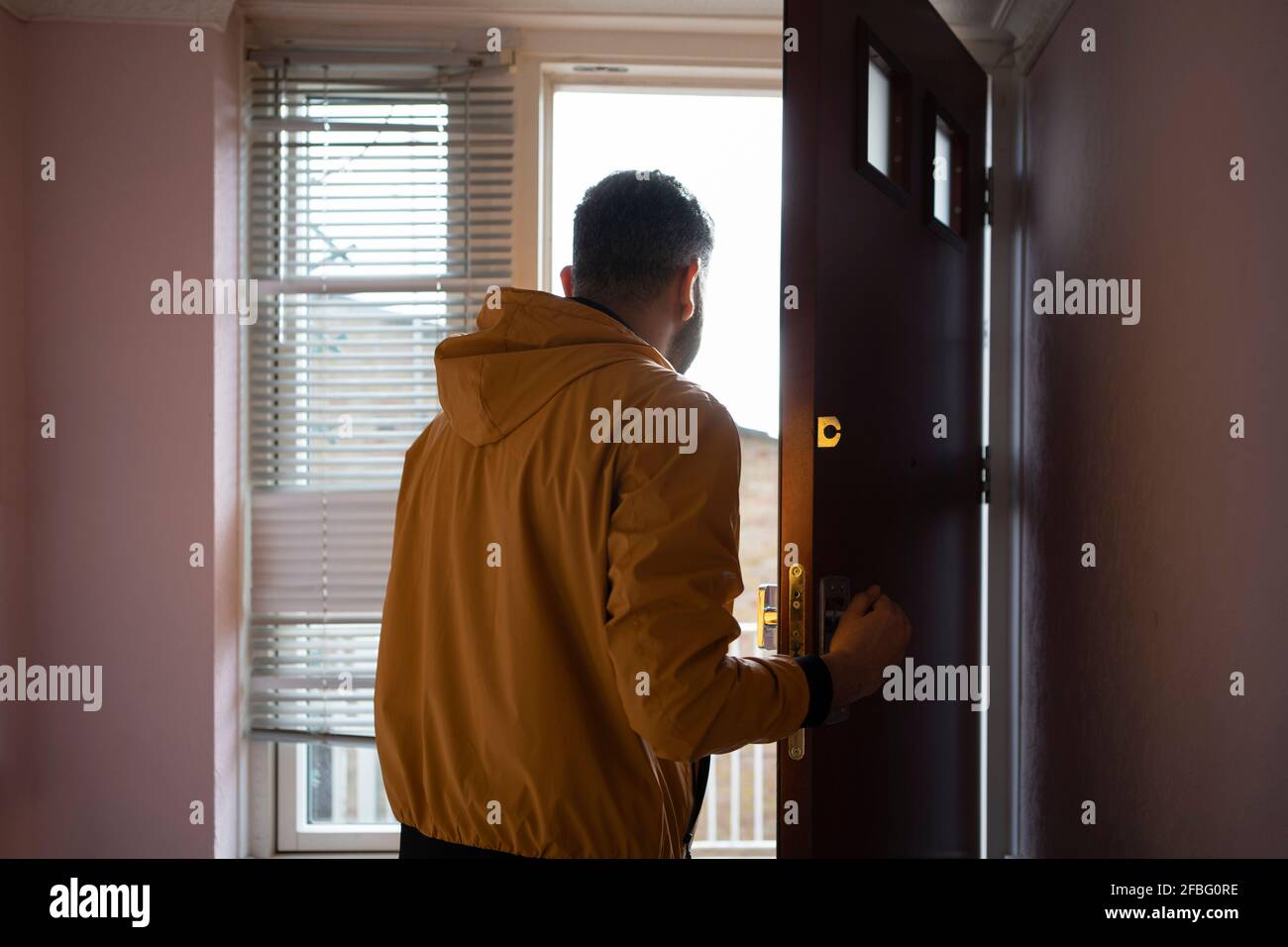 Man walking into door hi-res stock photography and images - Alamy
