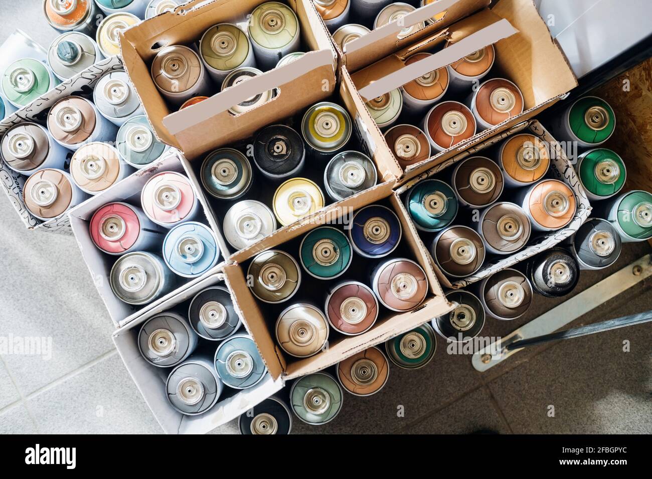 Spray paint cans in arranged in box Stock Photo Alamy