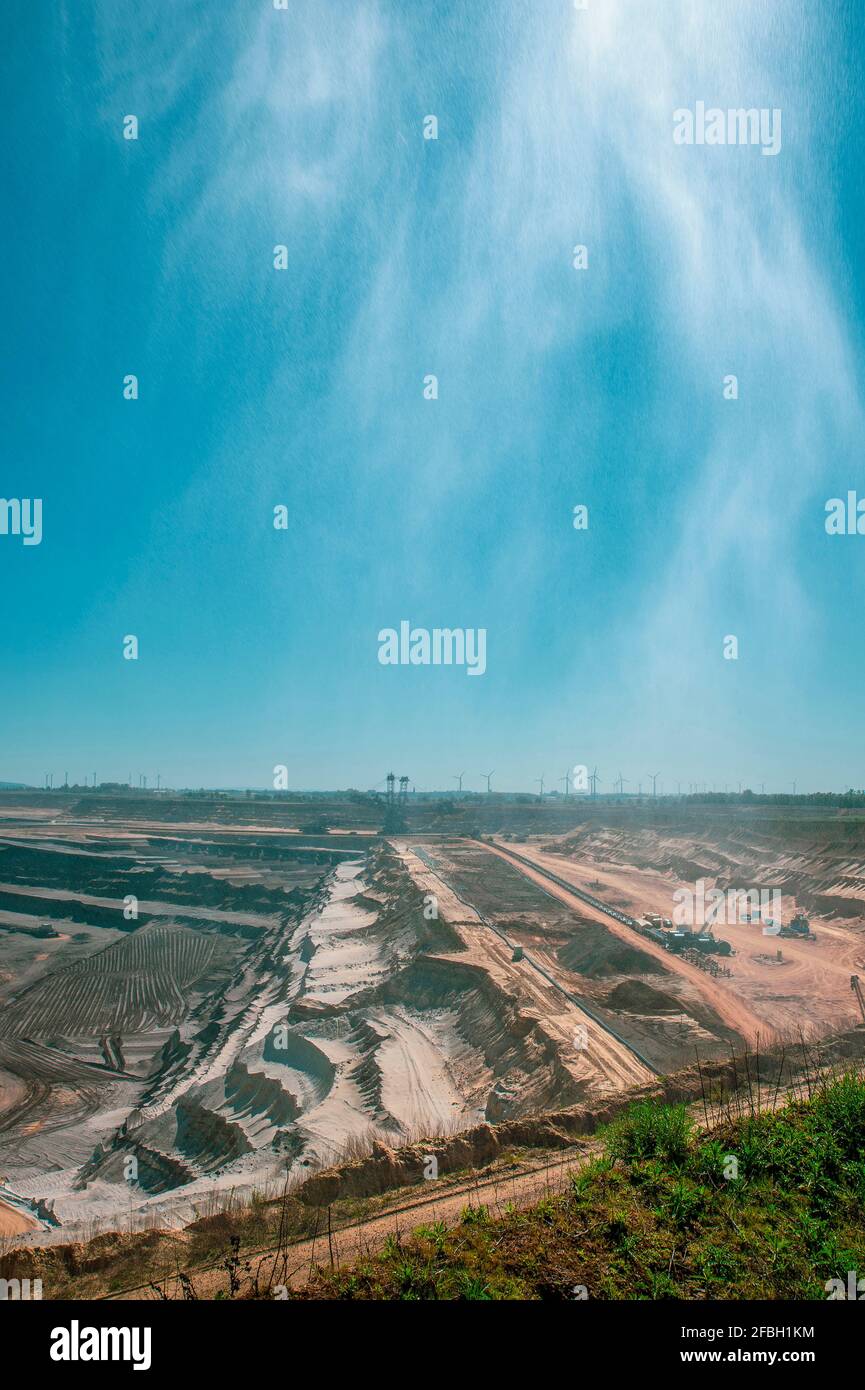 Blue sky over open-pit mine Stock Photo