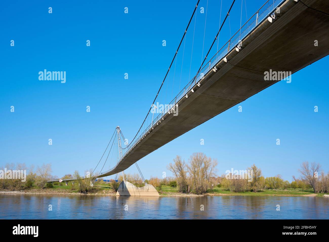 The suspension bridge Herrengrugsteg over the river Elbe on the elbe cycle route near Magdeburg in Germany Stock Photo