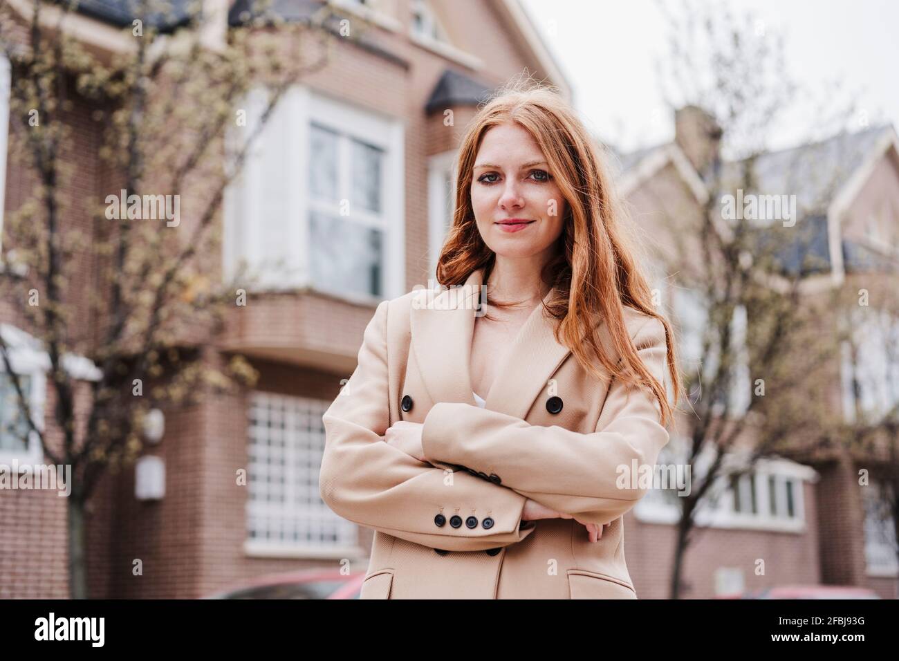 Redheaded woman arms crossed hi-res stock photography and images - Alamy
