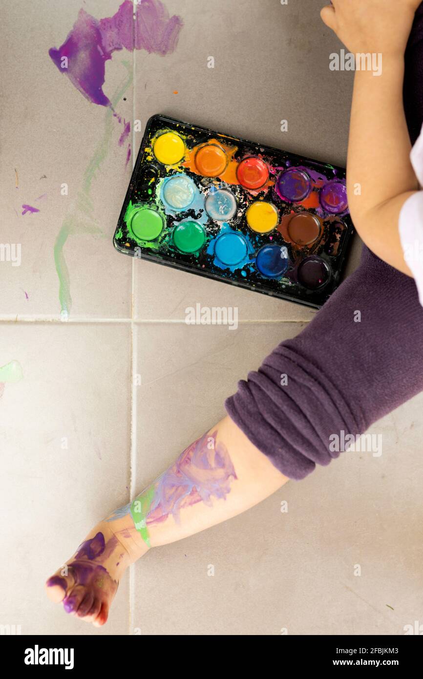 Little girl painting with watercolors Stock Photo - Alamy