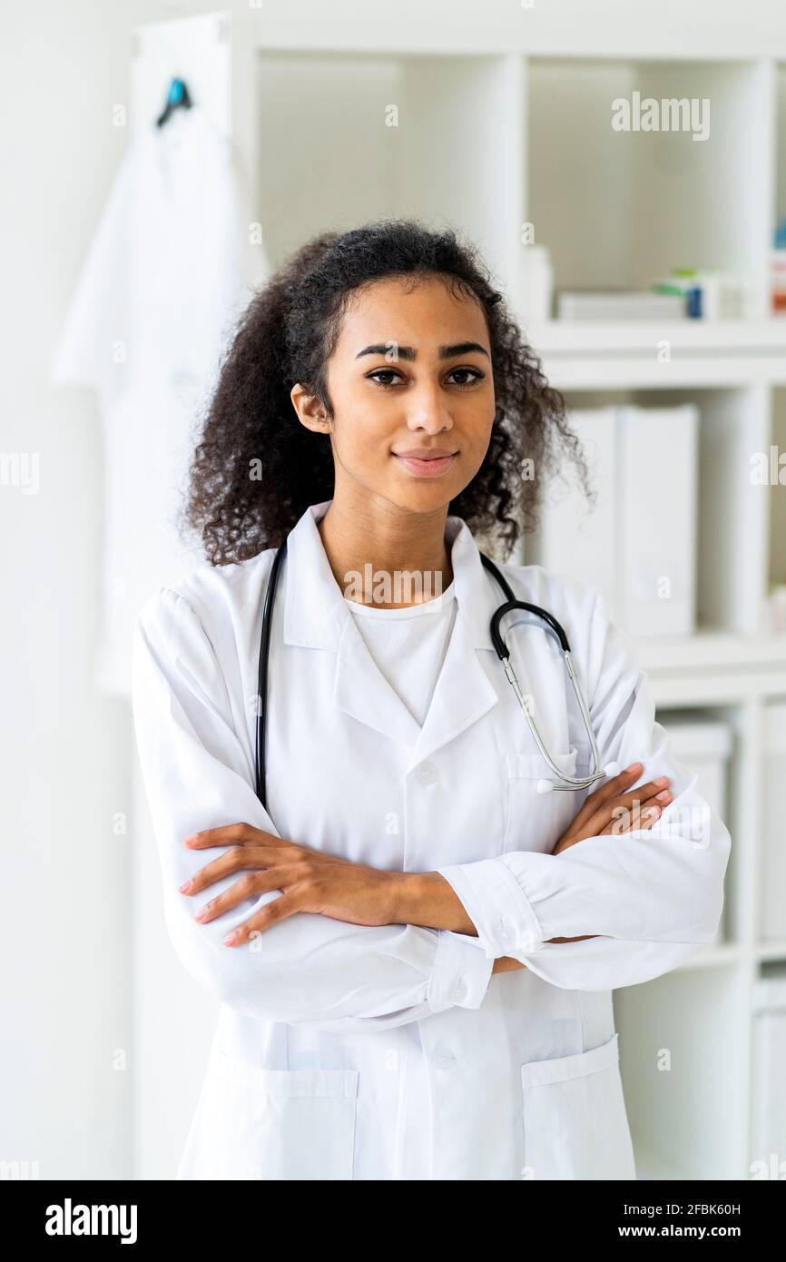 Black female doctor with arms crossed hi-res stock photography and ...
