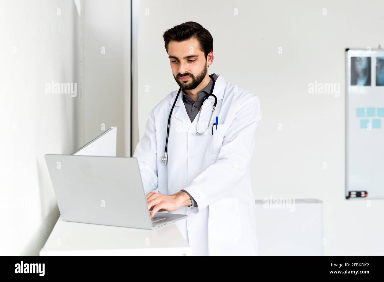 Young handsome male doctor in hi-res stock photography and images - Alamy