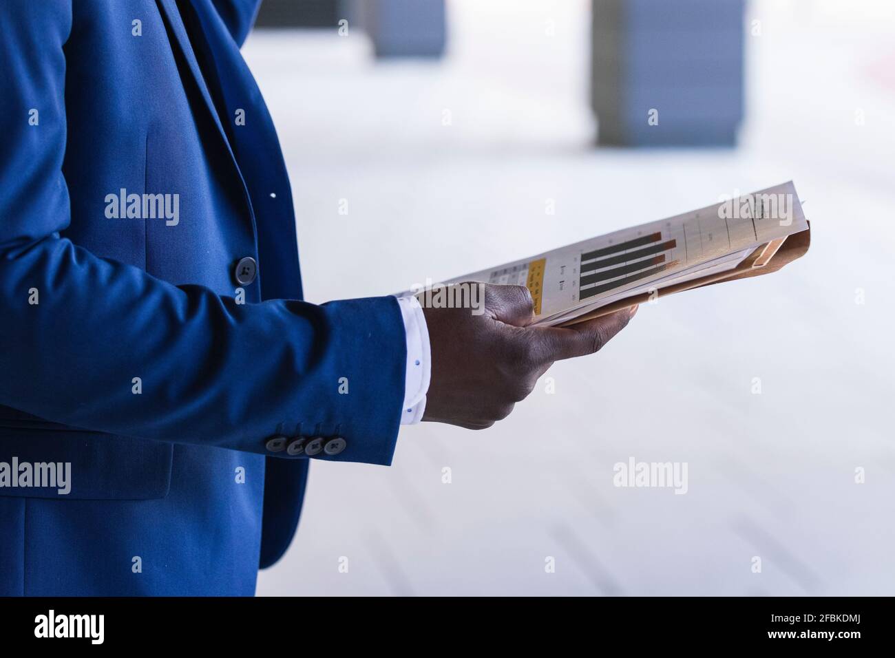 Male entrepreneur holding paper document Stock Photo