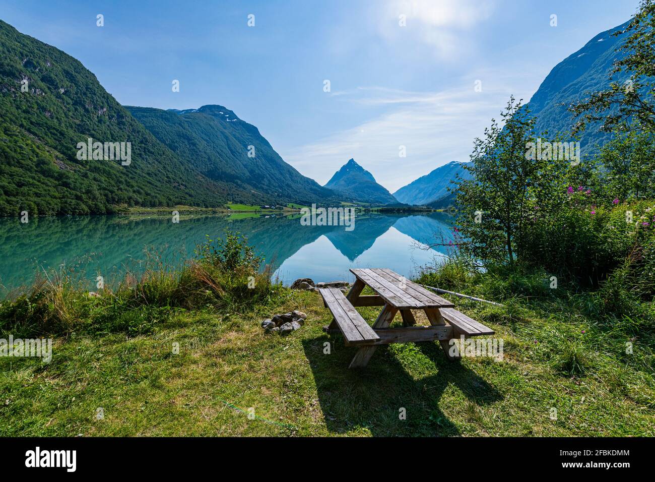 Norway, Byrkjelo, Picnic bench over Bergheimsvatnet lake in mountains Stock Photo