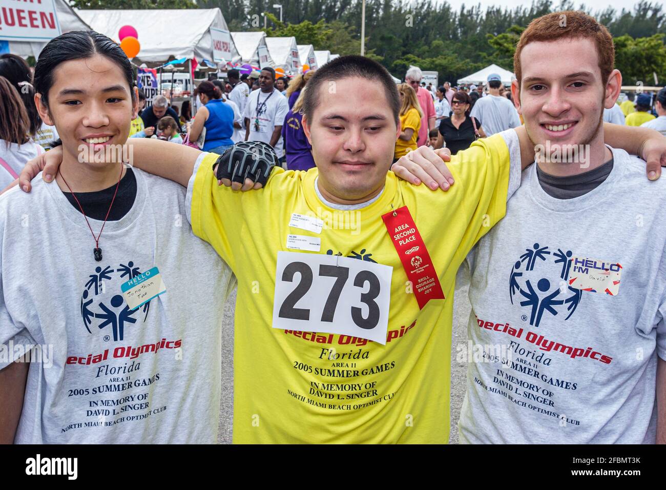 Florida North Miami FIU campus Special Olympics Summer Games,mentally disabled adult volunteer coach Asian teen teenage boy male,student, Stock Photo