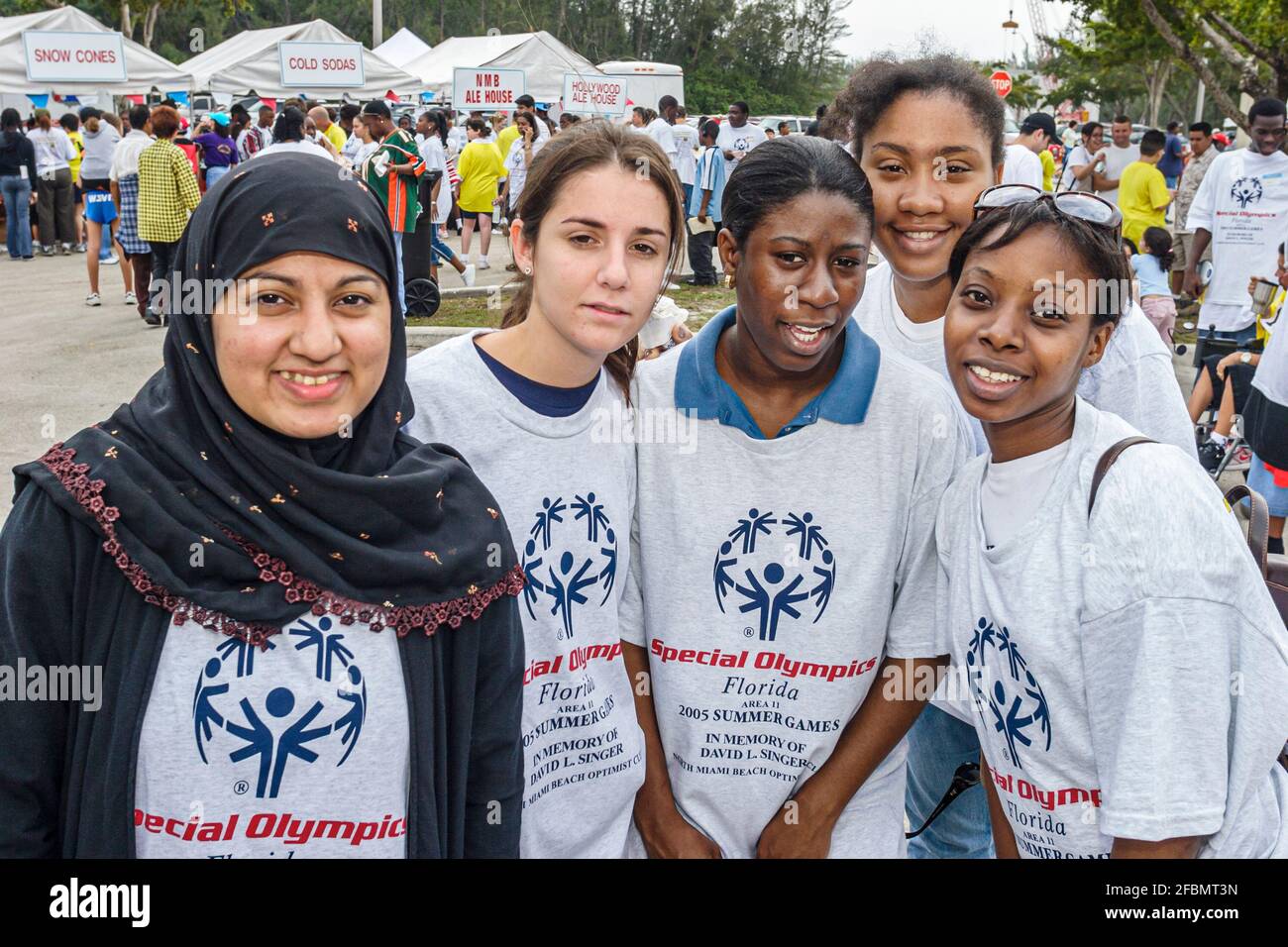 Florida North Miami FIU campus Special Olympics Summer Games,mentally disabled adult volunteer coach Muslim Black students,friends, Stock Photo