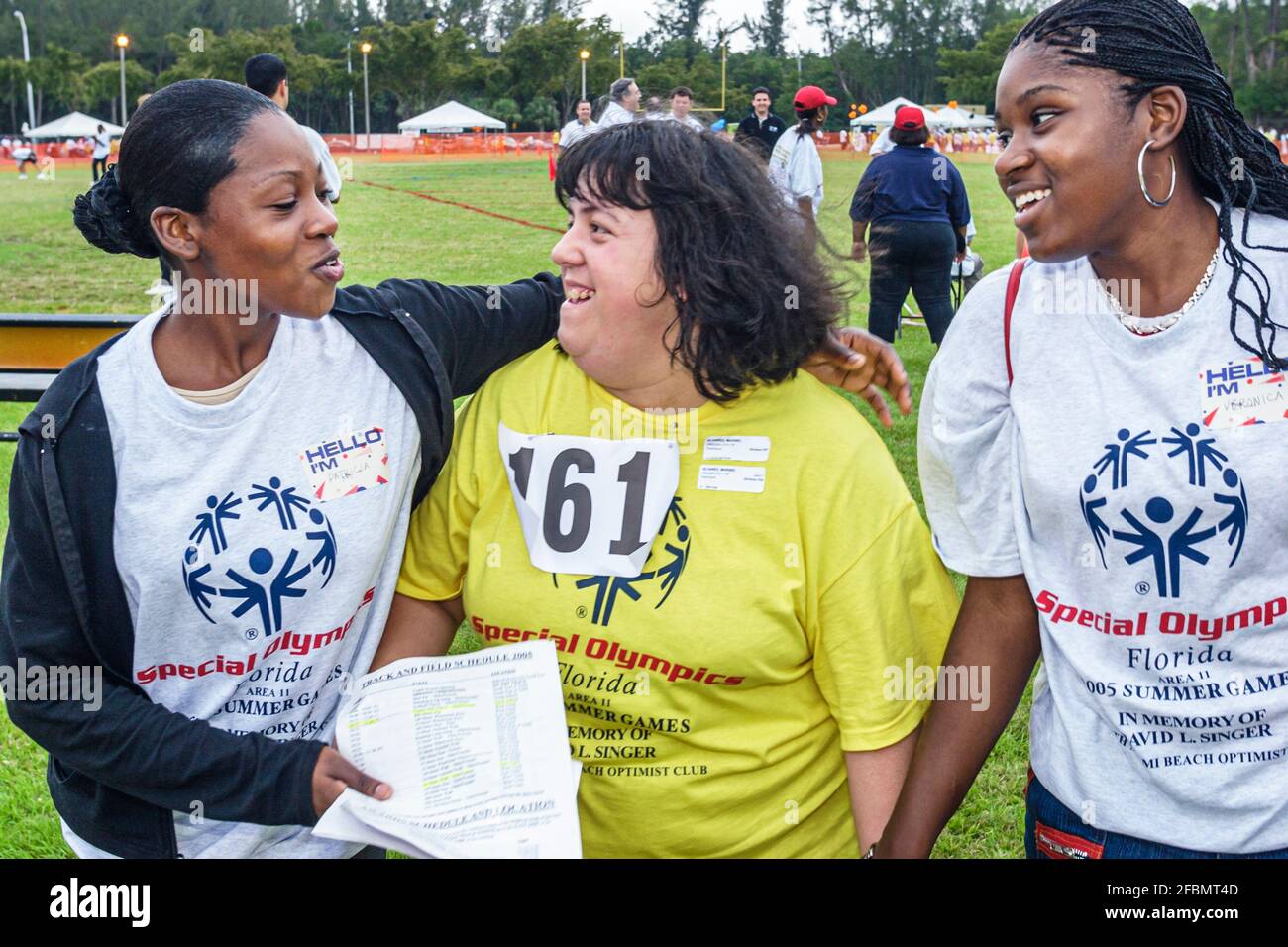 Florida North Miami FIU campus Special Olympics Summer Games,mentally disabled adult volunteer coach Black woman female women students, Stock Photo