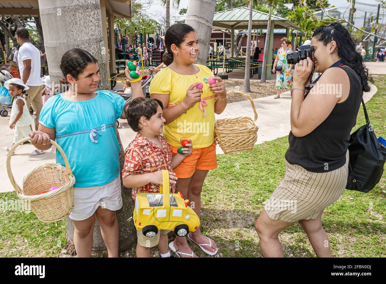 Miami Florida,Parrot Jungle Island Easter Egg Hunt,Easter Seals charity Hispanic family children mother daughters son girls boy siblings camera,posing Stock Photo