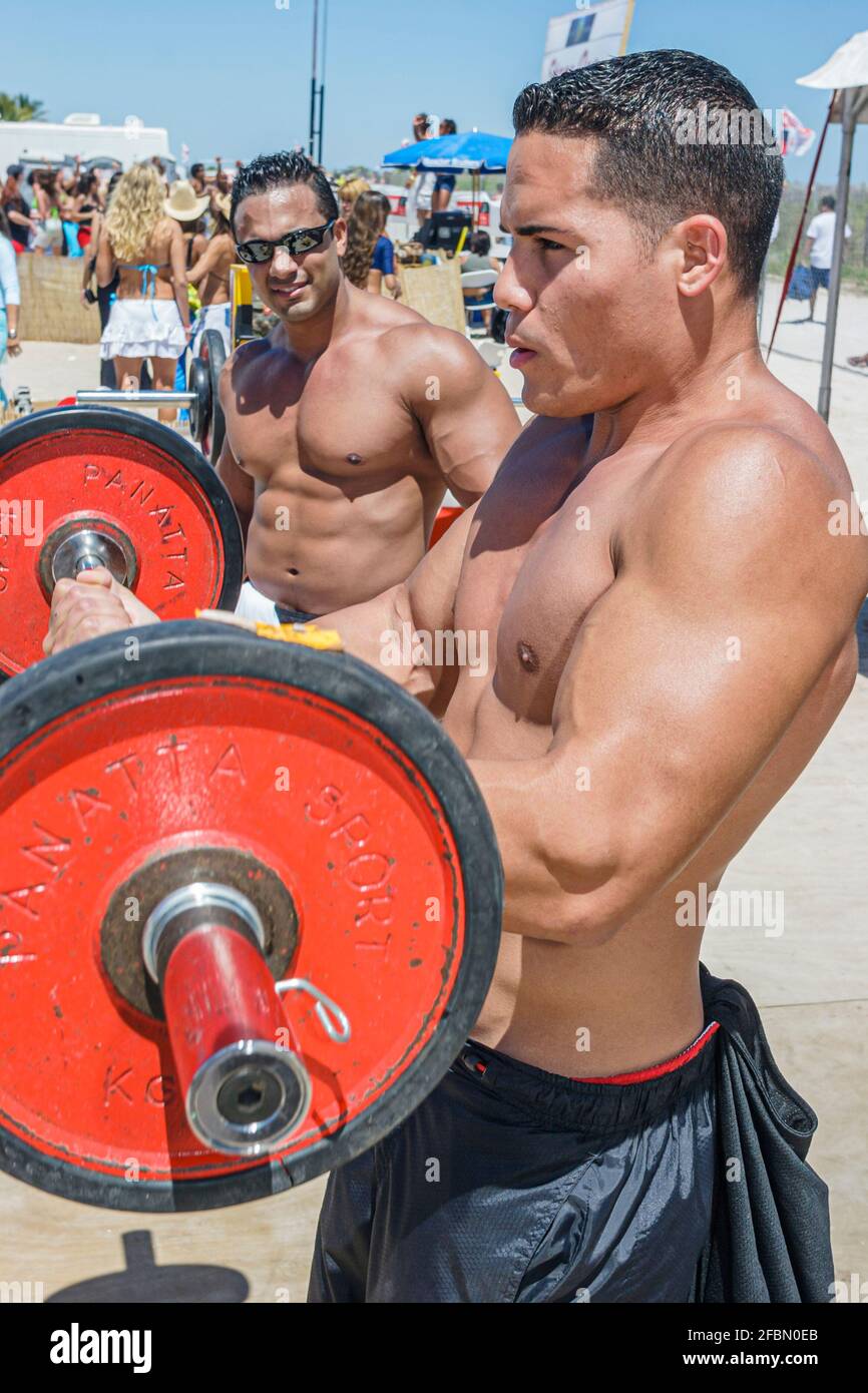 Miami Beach Florida,Ocean Drive,Lummus Park,Sport & Fitness Festival festivals fair,Hispanic man men male bodybuilders weightlifting lifting barbell, Stock Photo