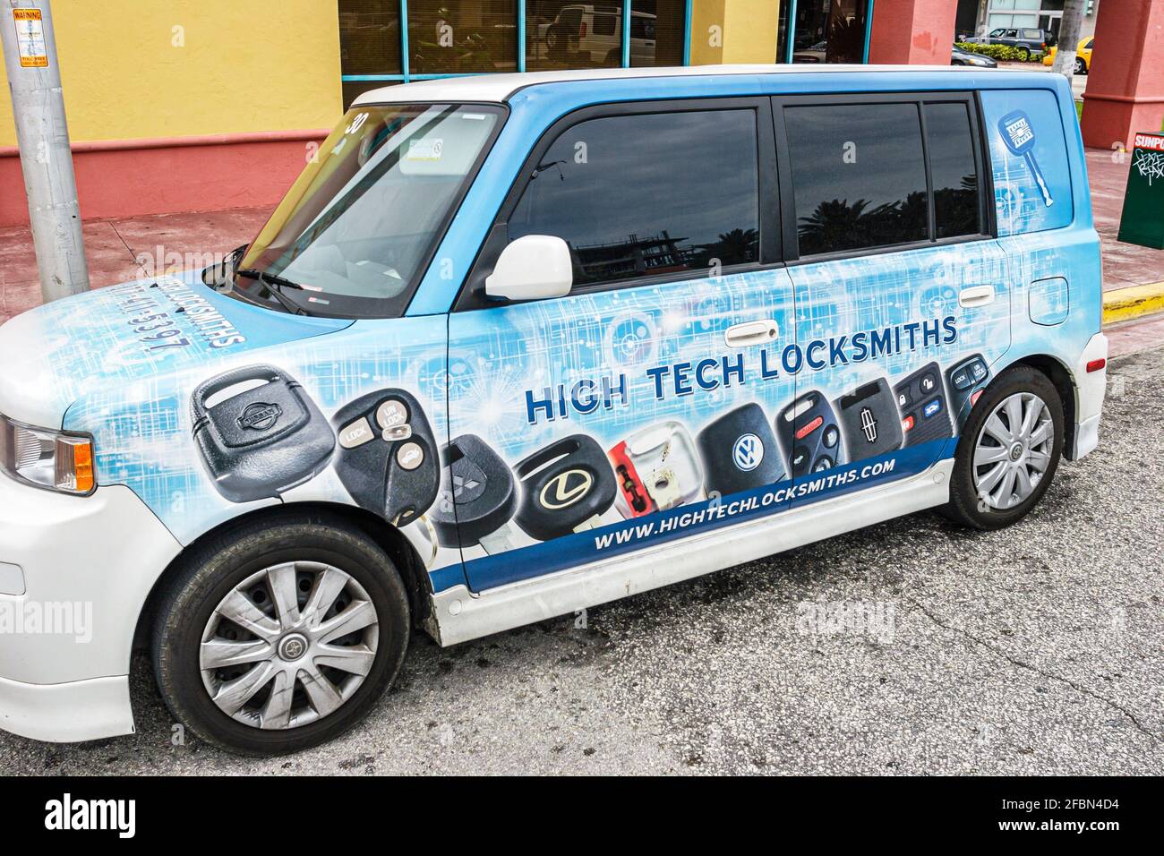 Miami Beach Florida,Collins Avenue High Tech Locksmiths vehicle advertising vinyl wrap, Stock Photo