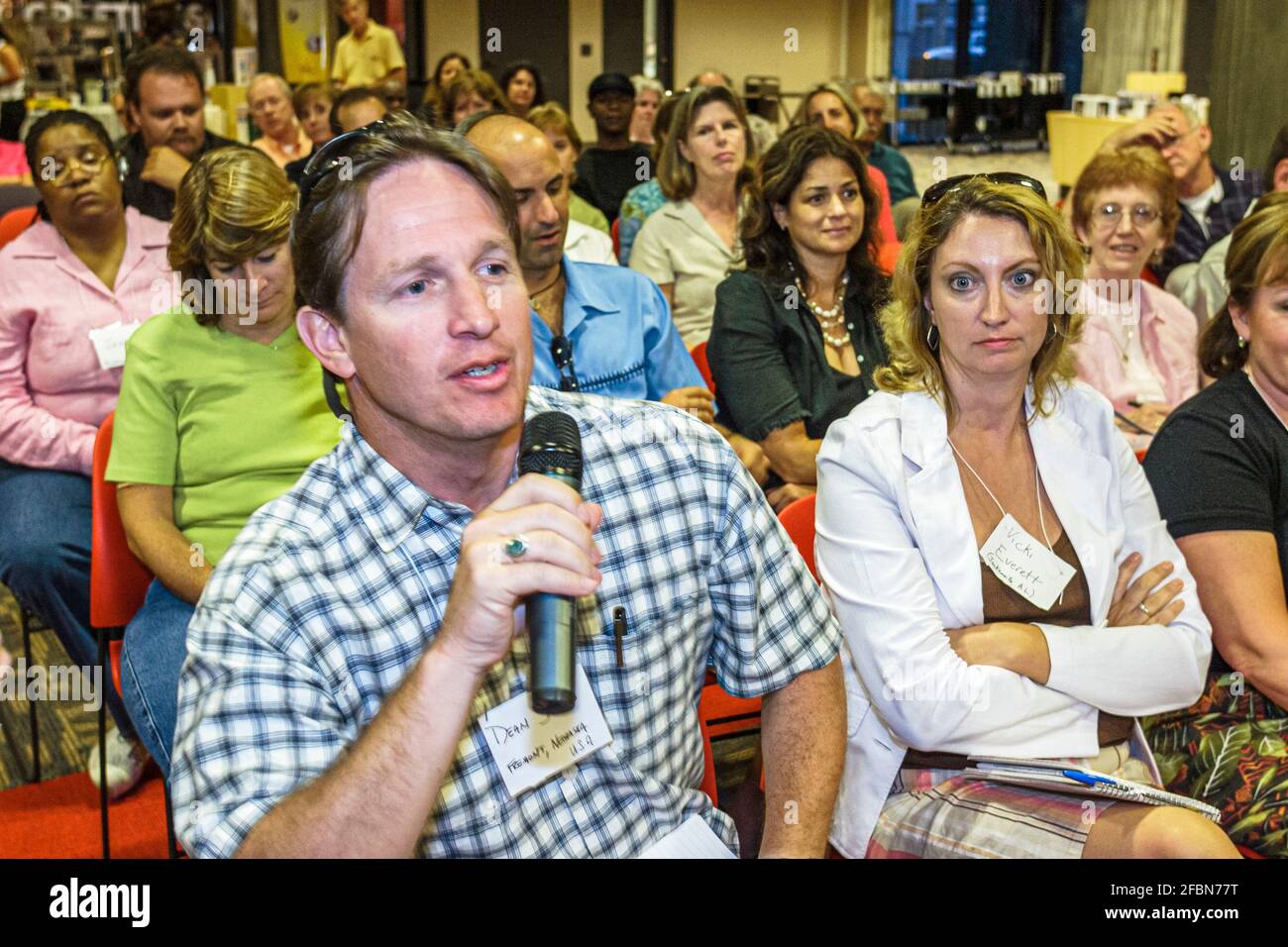 Orlando Florida,Central Avenue Public Library,guest speaker event audience man asking question holding microphone, Stock Photo