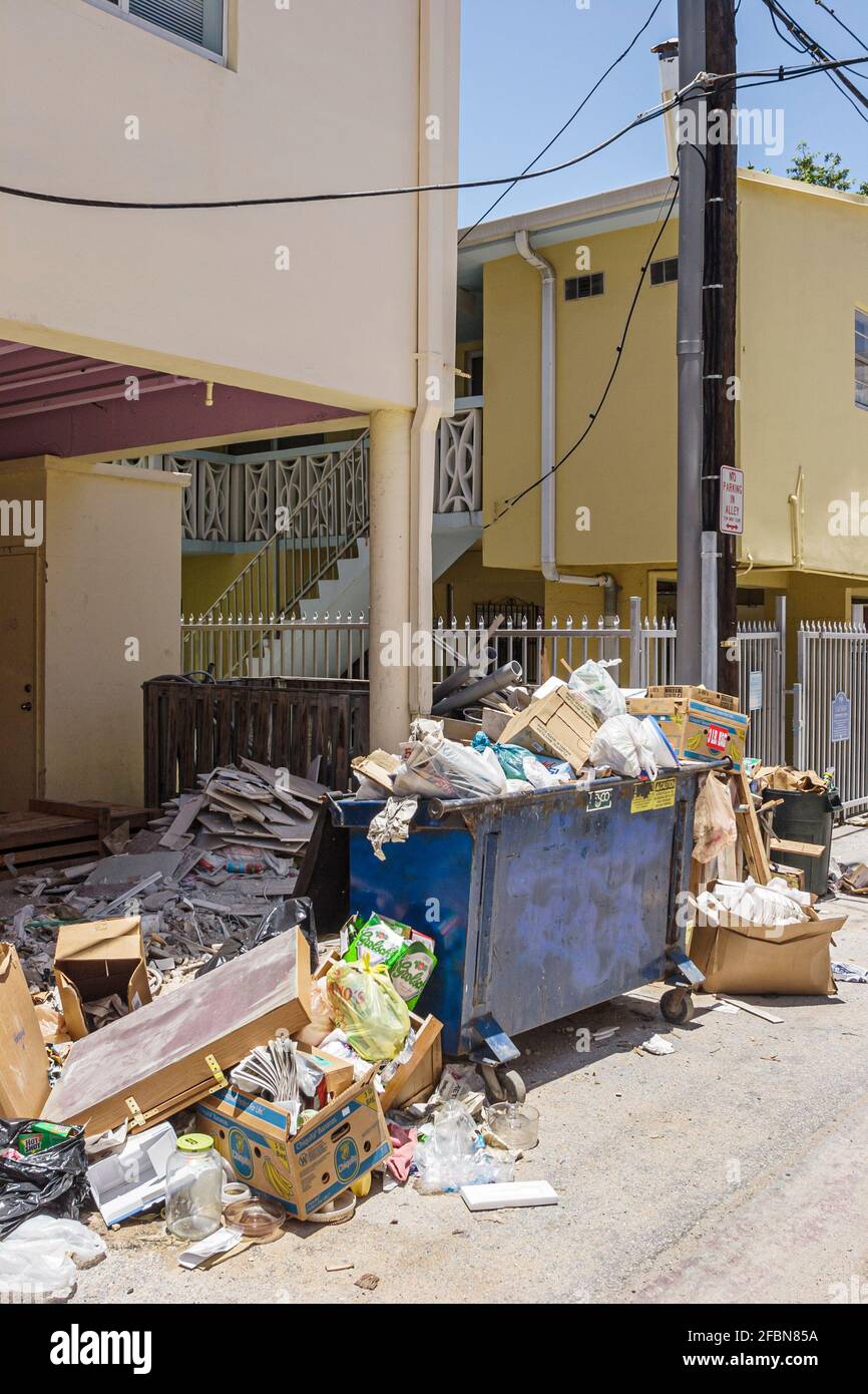 Miami Beach Florida,alley trash dumpster overloaded overfilled overflowing, Stock Photo