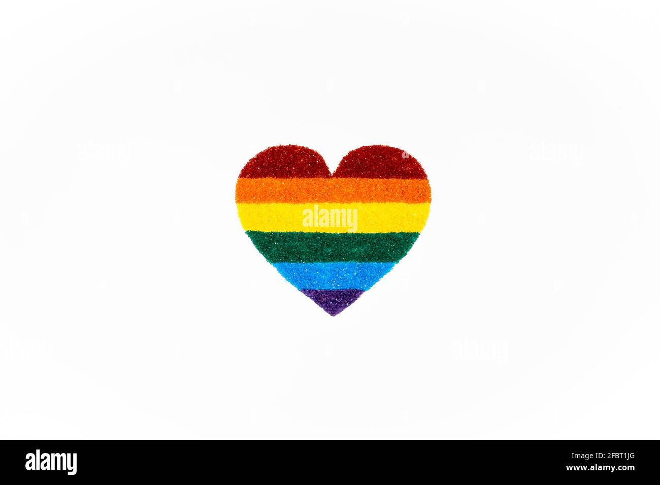 Rainbow made from sugar in heart shape Stock Photo